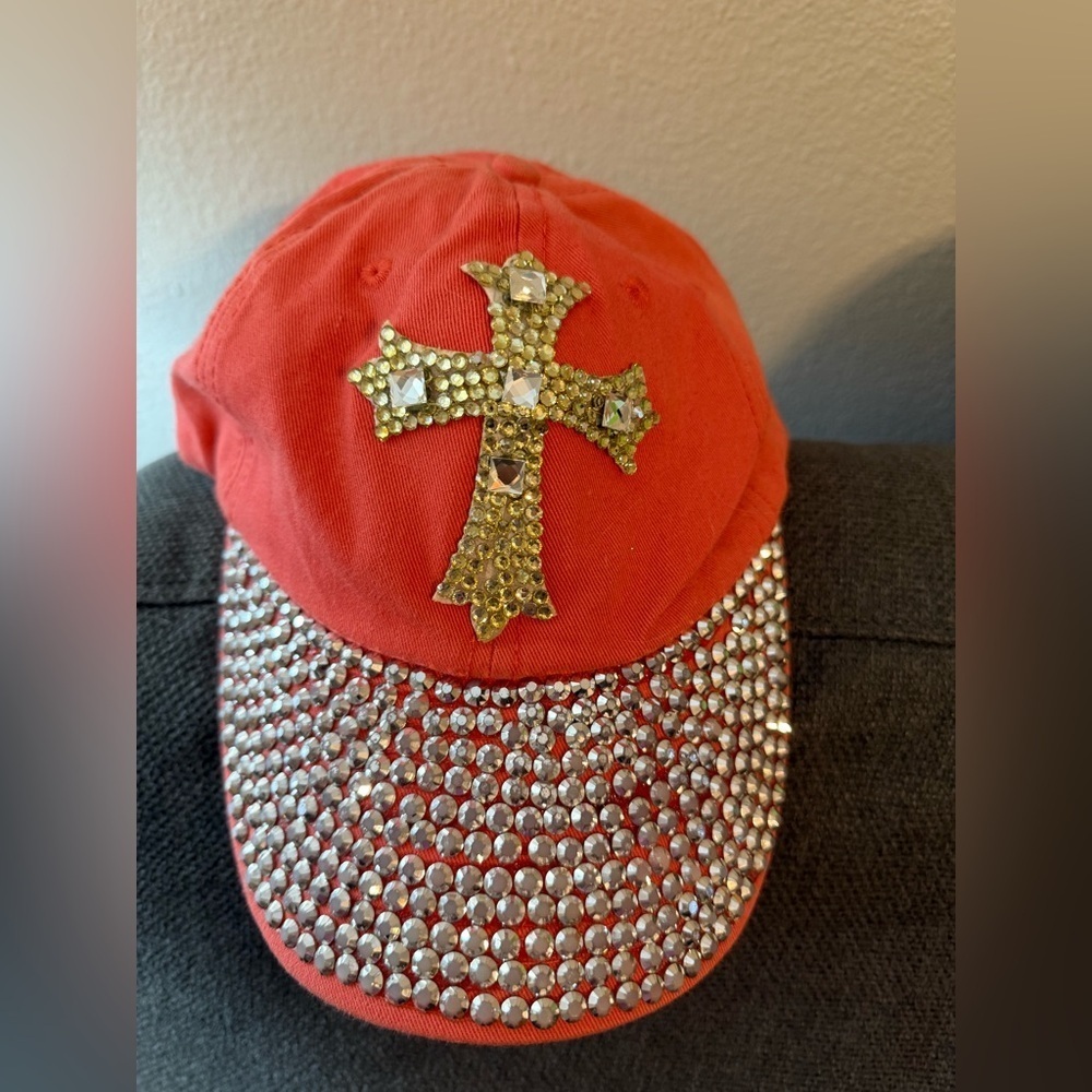 Woman’s one size fits all adjustable back salmon rhinestone cross baseball cap